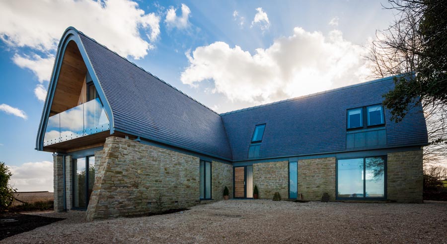 A comtemporary rural dwelling with a staffordshire blue roof